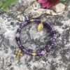 rosary bracelet with amethyst and goldtone beads on memory wire