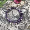 rosary bracelet with amethyst and silvertone beads on memory wire