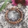 rosary bracelet with tigerskin jasper and silvertone beads on memory wire